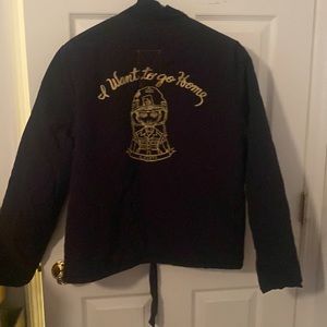 A. Kurtz boys black jacket. Size L. Outer is nylon. Inner is blanket like.